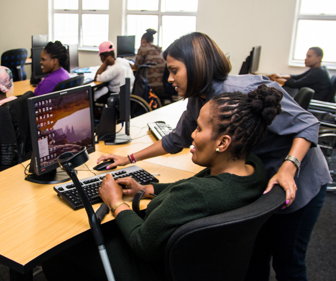 Learner with a disability working at a contact centre workstation during an EduPower learnership